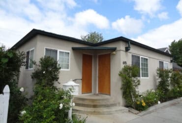 Modern suburban house with well-maintained garden and residential architecture.